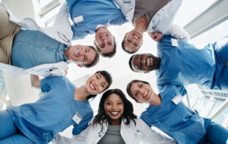 Medical personnel looking down at the camera